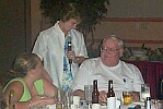 Dinner-Annie gives Norm the Memory Book, July 27, 2002